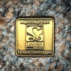 Mærket som viser at dette er en genbrugsgravsten